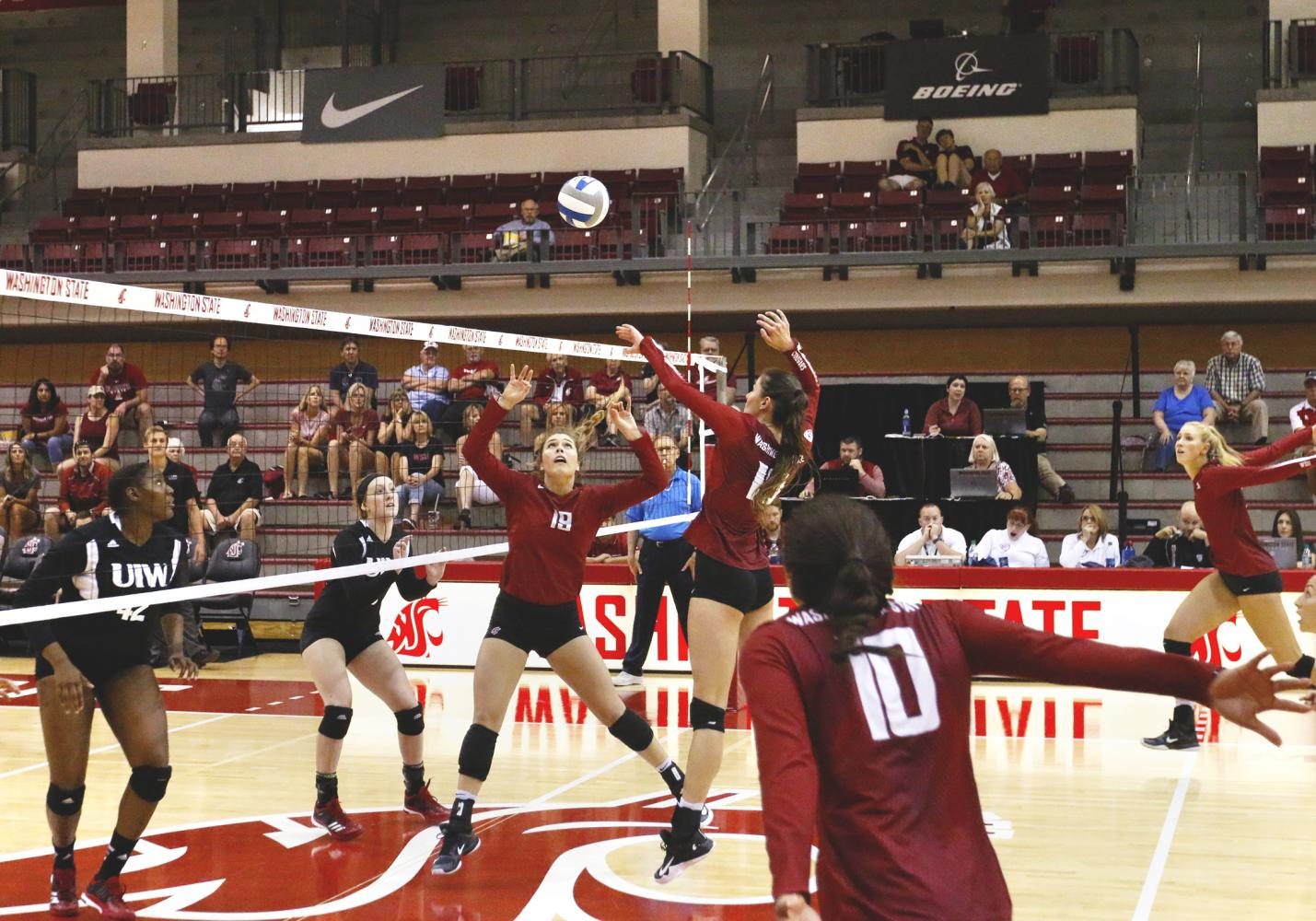 WSU sets the ball and prepares to spike against Incarnate Word during the Cougar Challenge on Thursday, August 31.