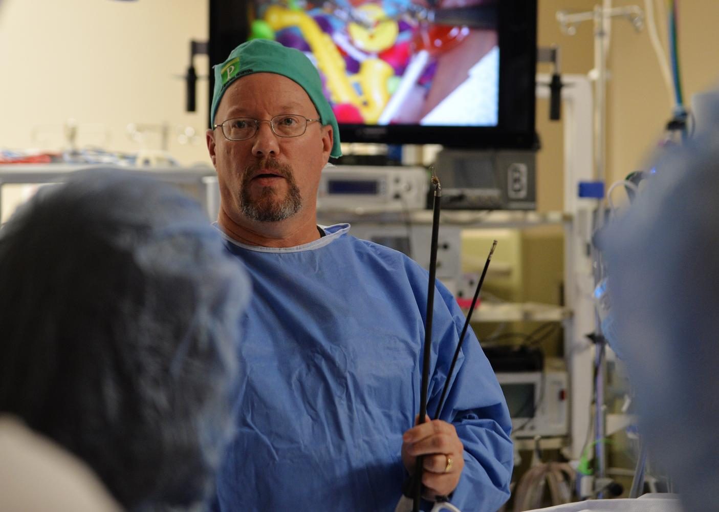 Ed Harrich, director of surgical services, talks about the da Vinci surgical robot used Friday at Pullman Regional Hospital.
