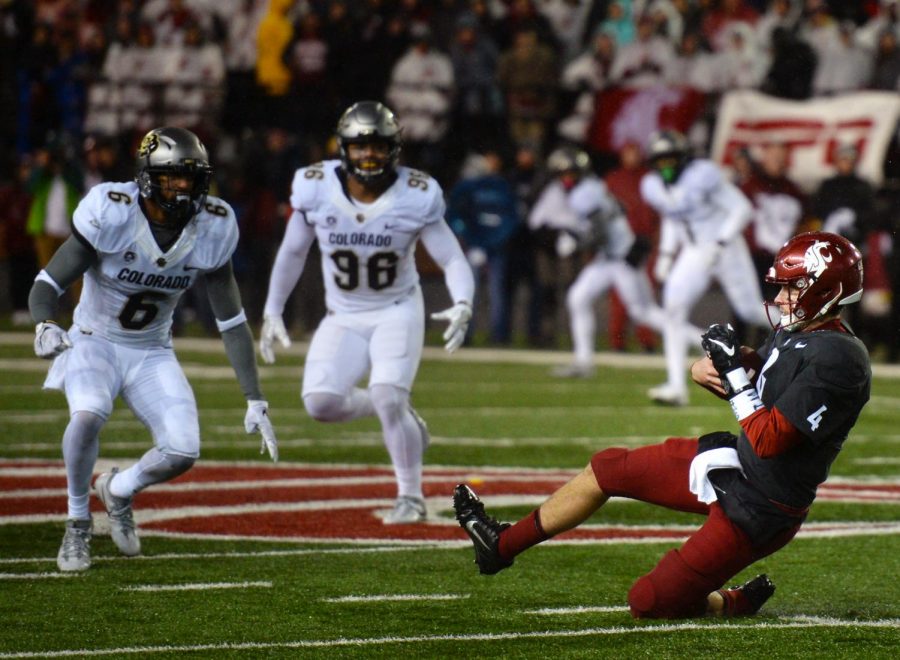 Redshirt senior quarterback Luke Falk slides for a first down in a game against University of Colorado, Boulder, on Saturday. WSU beat the Buffaloes 28-0.