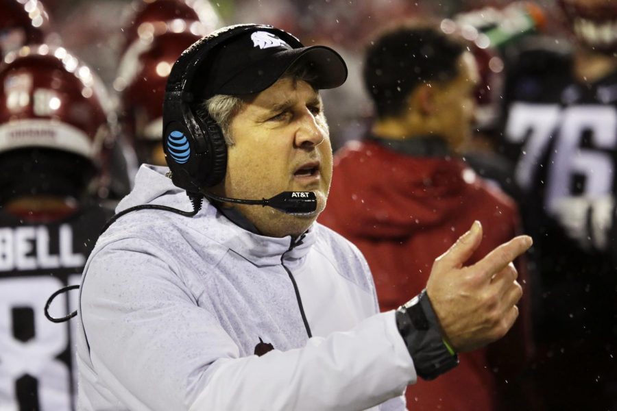 Head coach Mike Leach gestures to a player on the sidelines during the WSU vs. Colorado Homecoming game.