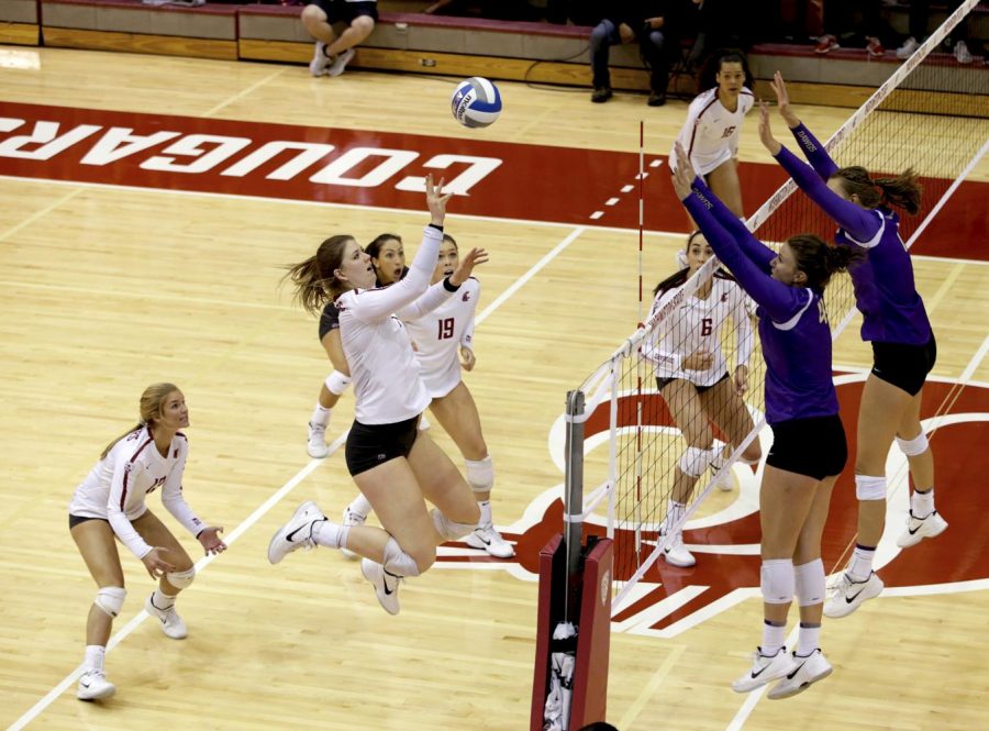 Junior outside hitter McKenna Woodford leaps to return the ball to UW during their match on Sept. 20. 2017
