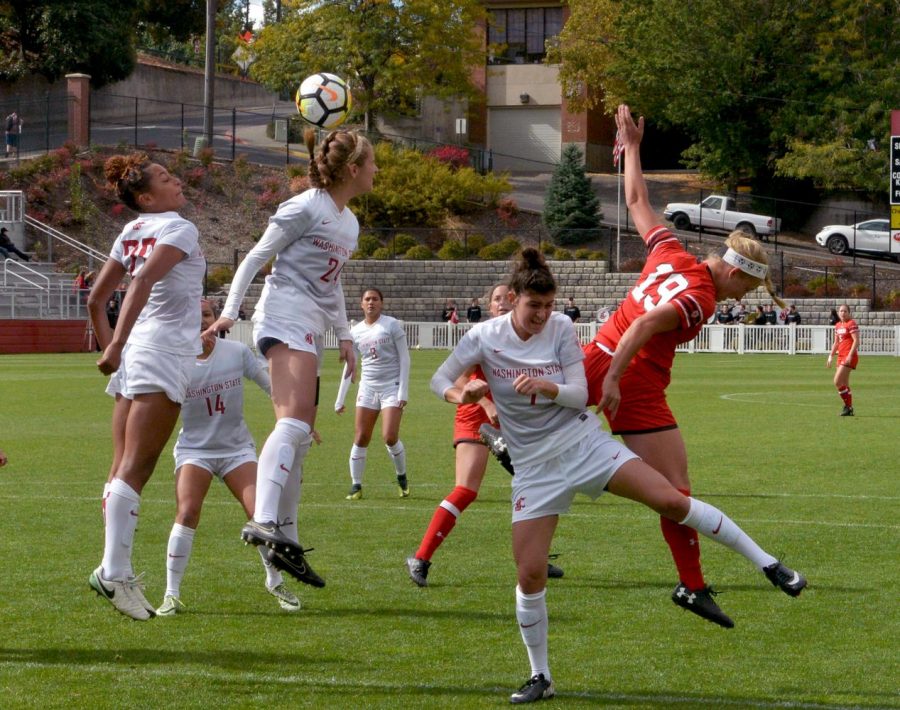 Junior midfielder Maegan O’Neill leaps for a header before an attempt on goal during a match against Utah on Oct. 1.