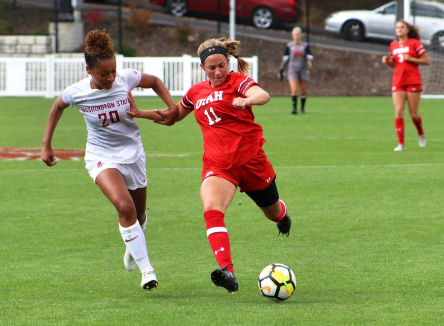 Utah junior forward Max Flom moves the ball toward the WSU goal as Cougar freshman defender Aaqila McLyn attempts a steal during the Oct. 1 match.