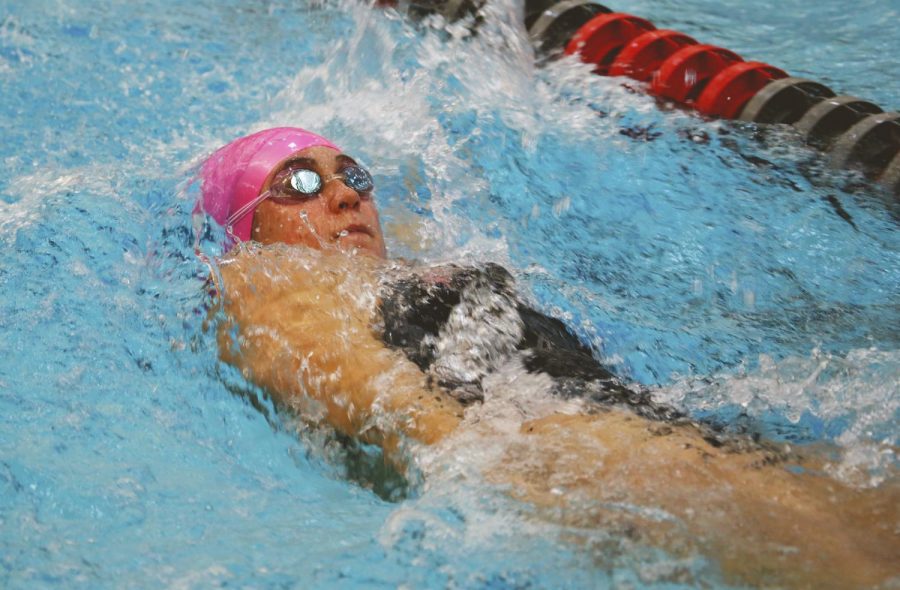 A Cougar swimmer competes in a backstroke event against University of Arizona on Oct. 14. WSU lost 101-161 at Gibb Pool.