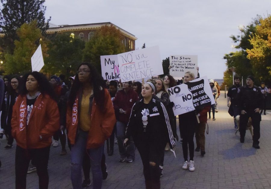 Survivors of sexual assault and domestic violence and their supporters march past Bryan Hall, chanting Silence is NOT Consent during the Take Back the Night march on Thursday evening.