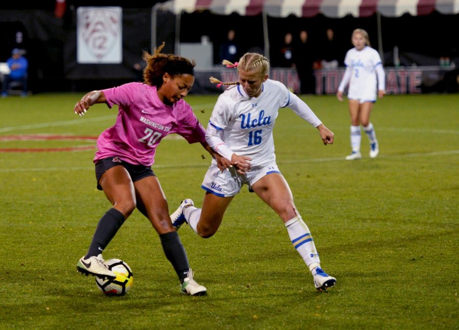 Freshman defender Aaqila McLyn battles with UCLA over possession of the ball during Thursdays match. WSU upset No. 2 UCLA, ruining the Bruins undefeated season.
