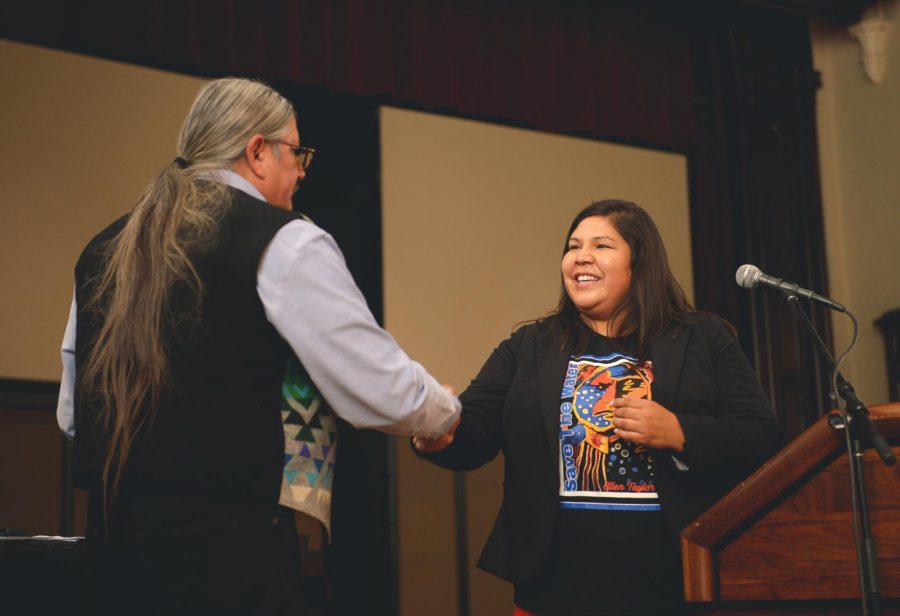Sydel Samuels, director of the University of Idaho’s Native American Student Center, greets Pete Purtra of the Shoshone-Paiute tribe, during Indigenous Peoples’ Day events Monday.