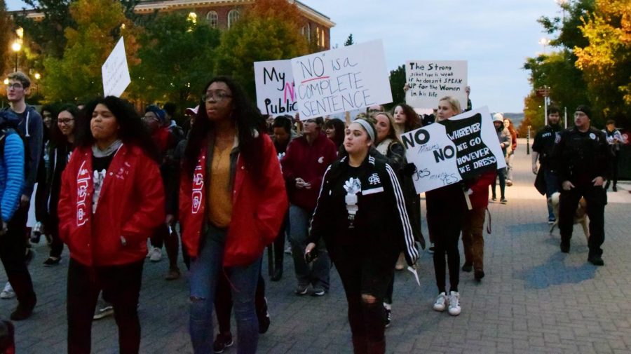 Survivors of sexual assault and domestic violence and supporters march past Bryan Hall, chanting “Silence is not consent”
during the Take Back the Night march Thursday evening.