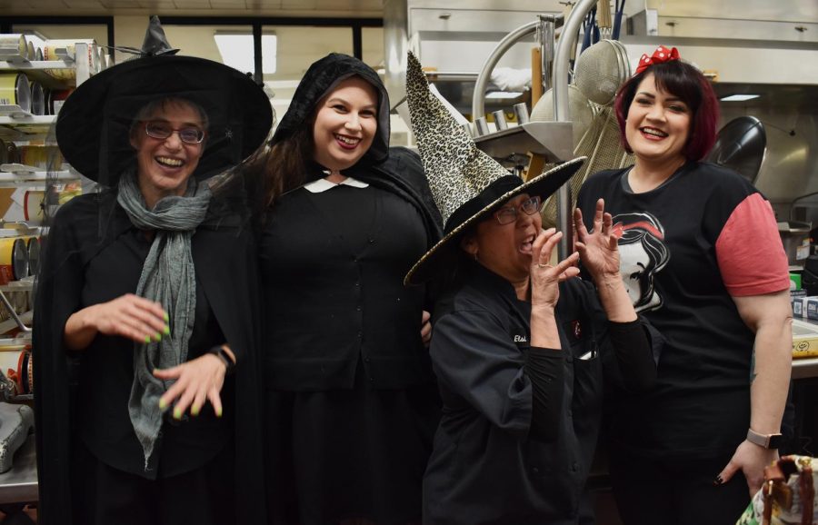 Left to right: Dining Services Sarah Larson, Jeanette Patteson, Elsie Sakuma dressed as witches and Jamie Kohler as Snow White.