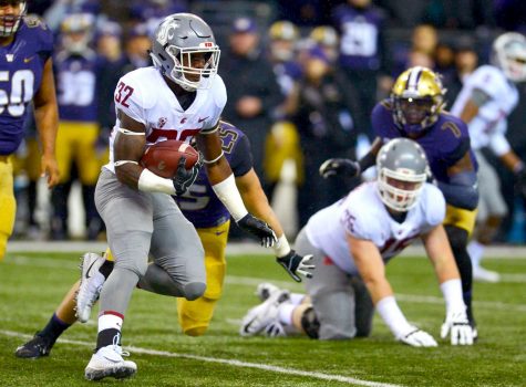 Then-redshirt sophomore running back James Williams avoids UWs defense during the 2017 Apple Cup.