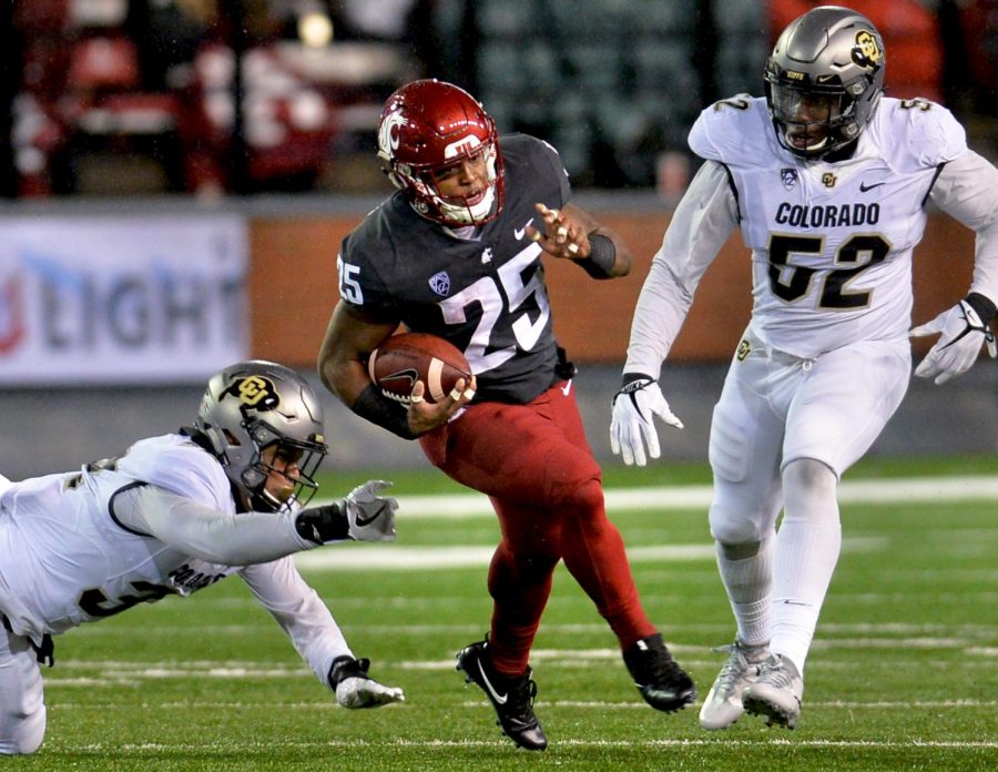 Redshirt senior running back Jamal Morrow dodges a Colorado defender during the Oct. 21 game against the Buffaloes.