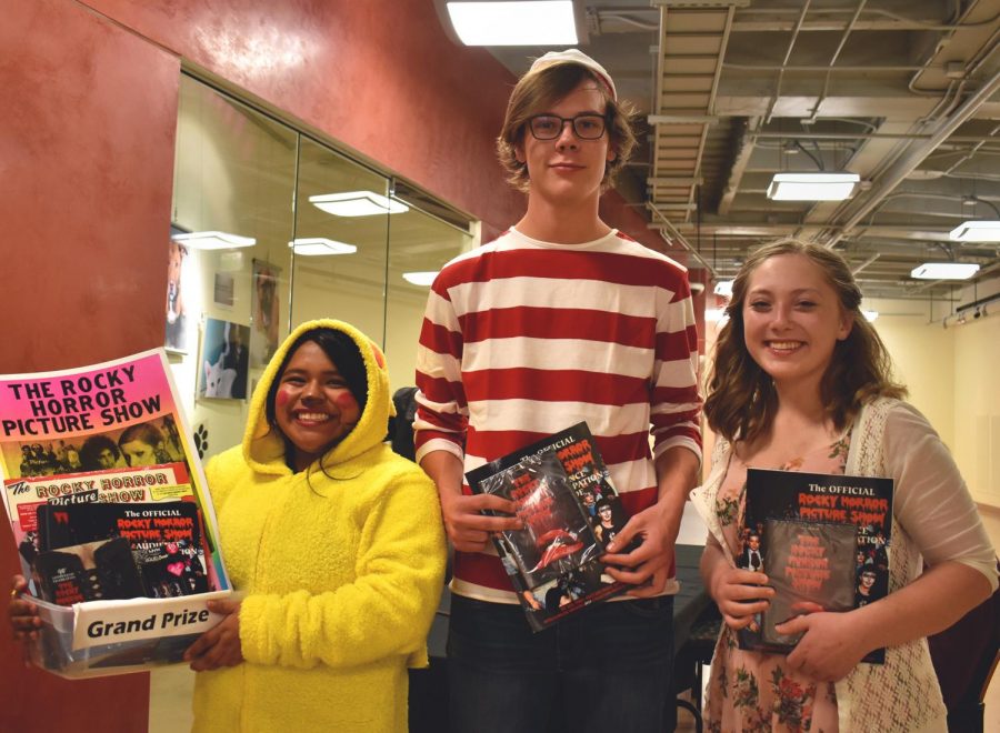 Winner of the costume contest at the screening of “The Rocky Horror Picture Show,” Tania Vargas as Pikachu, left, and runner ups Morgan Hostettler as Waldo and Allison Wolf as Janet Weiss. 