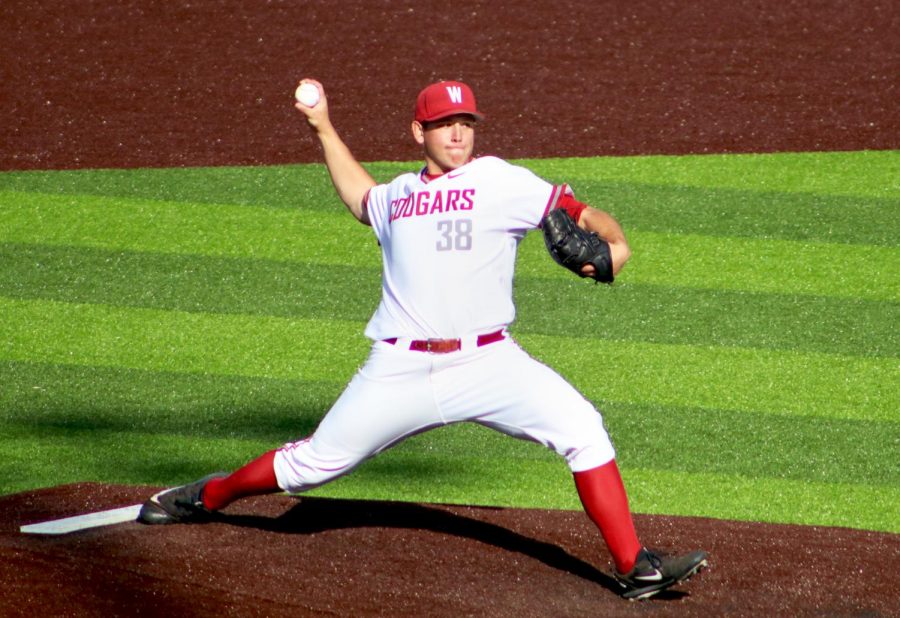 WSU+redshirt+sophomore+right-handed+pitcher+Davis+Baillie+goes+through+his+windup+to+deliver+a+pitch+during+the+Oct.+1+exhibition+game+against+Central+Washington+University.+The+Cougars+won+23-5.