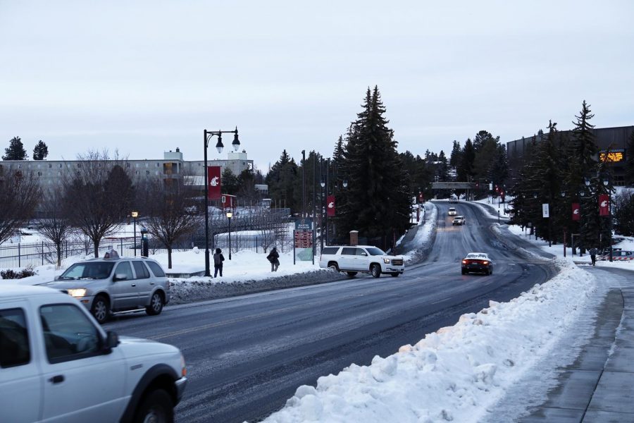 Cars on Stadium Way moved slower than usual due to icy road conditions caused by heavy snowfall in the beginning of the spring semester. Due to the icy road conditions, some cars slipped while on the road.