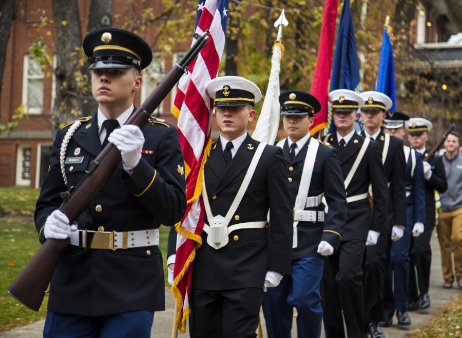 The color guard march down the Glenn Terrell Friendship Mall toward the Veterans Memorial for the Veterans Day Ceremony on Thursday. See more photos online.
