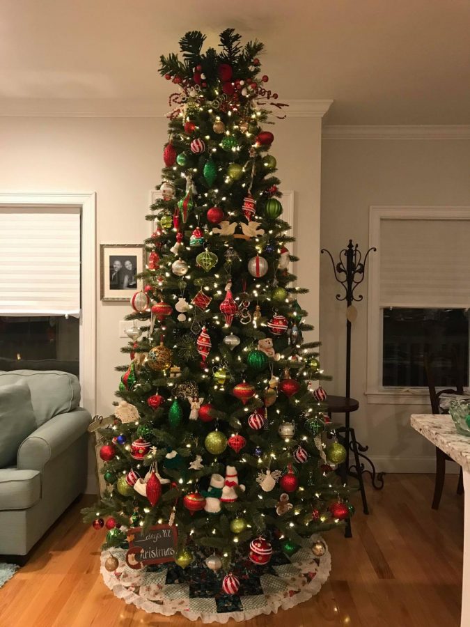 Mint Editor Gabriella Ramos Christmas tree at her familys home in Salisbury, Massachusetts. Her mom got this tree for free, and they drove it home in her convertible in the middle of January. The artificial tree is so tall, they had to remove the top piece to make it fit in the house.