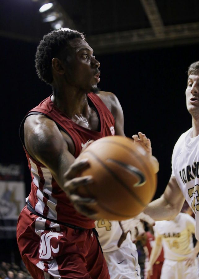Junior forward Robert Franks passes the ball across the court at the Vandal basket on Wednesday at the Kibbie Dome.
