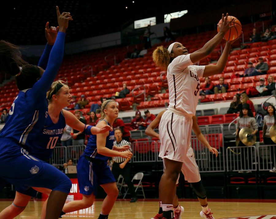 Breaking away from the Saint Louis defense, sophomore forward Kayla Washington successfully adds two points to the Cougs lead Monday evening in Beasley Coliseum.
