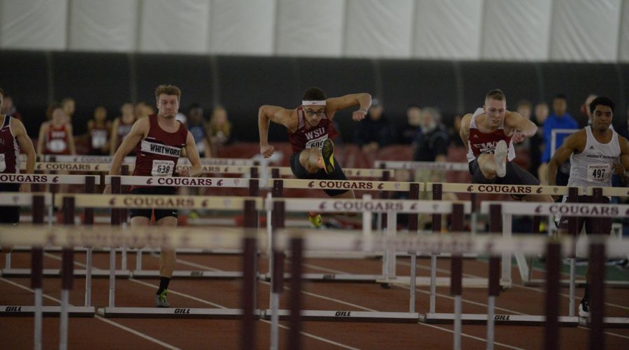 WSU+junior+hurdle+Christapherson+Grant%2C+middle%2C+focuses+as+he+clears+the+hurdle+during+his+60-meter+hurdles+heat+at+the+WSU+Indoor+Open+on+Saturday+at+the+Indoor+Practice+Facility.