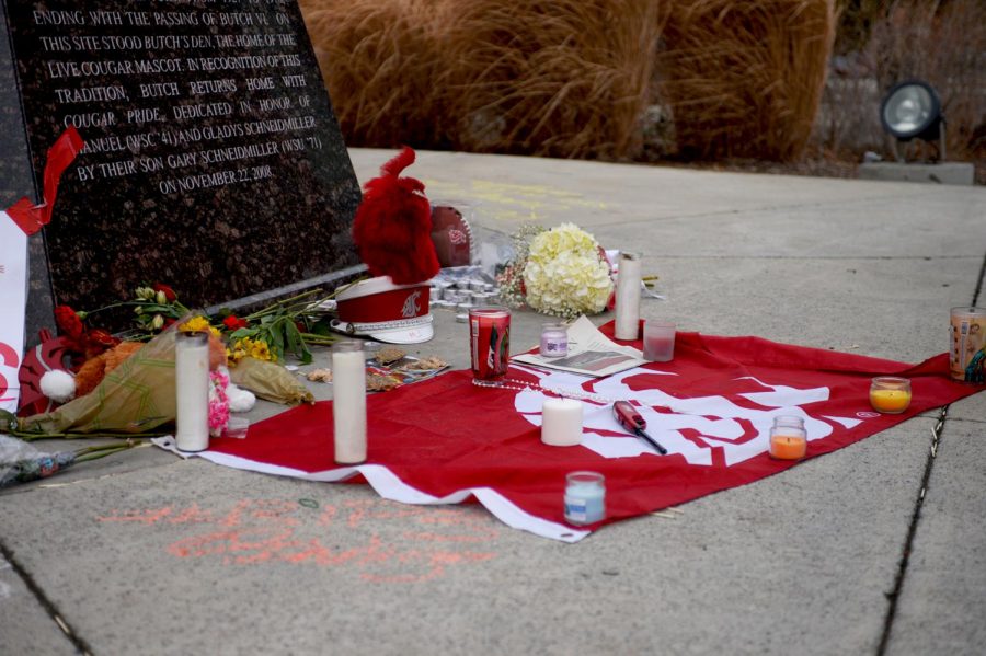 Candles, flowers, cougar memorabilia and a copy of the Daily Evergreen recapping the football game against Boise State University during which Tyler Hilinski led the Cougars to a comeback victory were some of the items left by mourning community members at a memorial in front of the Cougar statue on Jan. 17, 2018.