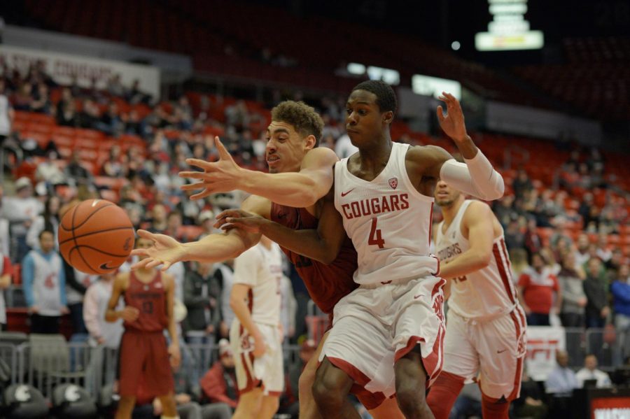 WSU’s junior guard Viont’e Daniels battles Stanford’s senior forward Dorian Pickens for a rebound under the Stanford hoop during the game in Beasley Coliseum Thursday evening