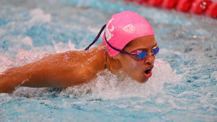 Senior breaststroke and butterfly swimmer Anna Brolin pushes her way through the water during a swim meet.