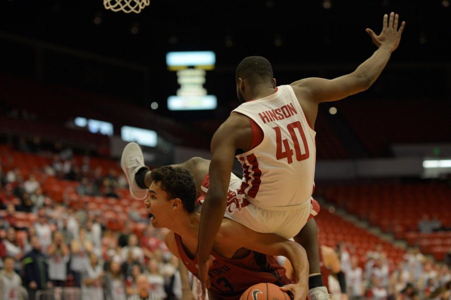Stanford’s freshman forward Oscar Da Silva pump fakes, leading WSU’s junior guard Kwinton Hinson to jump in the air and accidentally come down on top of his opponent in the game played Thursday evening in Beasley Coliseum.