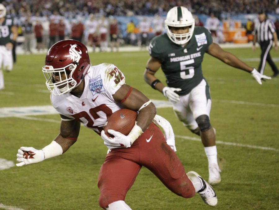 Redshirt sophomore running back James Williams runs the ball against Michigan State on Dec. 28 in the Holiday Bowl.