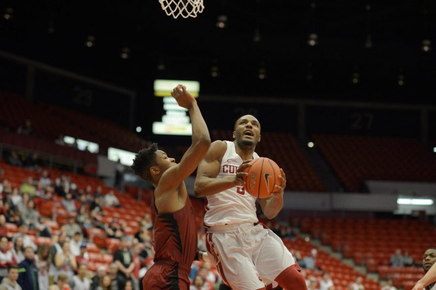 WSU redshirt freshman guard Milan Acquaah drives to the basket against Stanford at Beasley Coliseum. WSU lost 79-70,