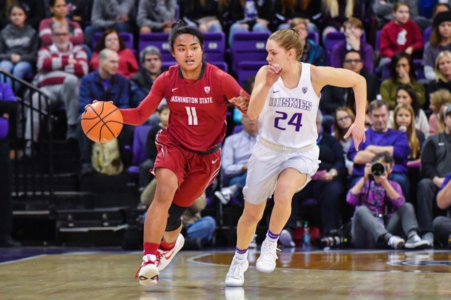 Chanelle Molina dribbles down the court during the UW matchup Sunday at Alaska Airlines arena. 