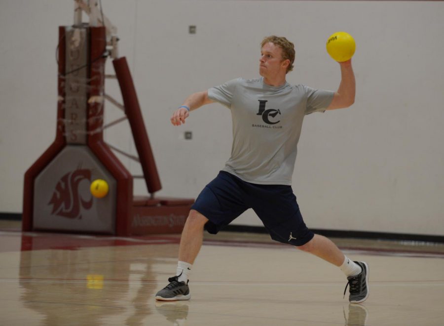 Quinton+McDaniels+throws+the+ball+during+a+warm-up+session+of+dodgeball+Monday+at+the+Physical+Education+Building.