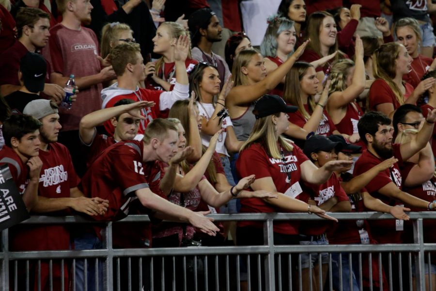 Fans cheer at a WSU football game against BSU on Sept. 9 at Martin Stadium. Attendees will now have to carry a small clutch or clear bag to bring their belongings into Martin Stadium.