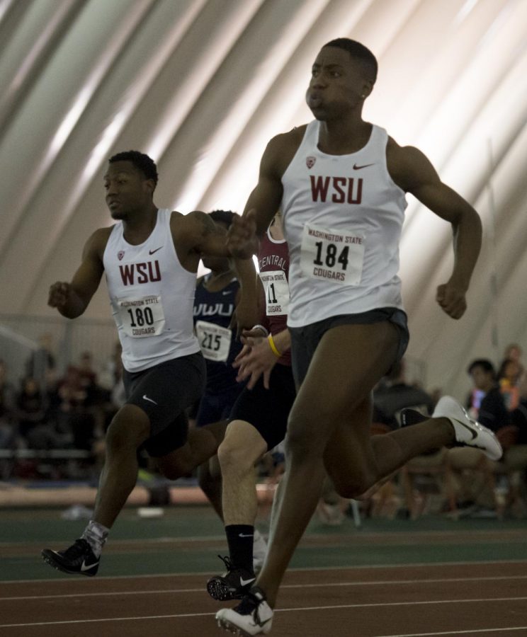 Junior Ja’Maun Charles, front, races in the 60 meter dash prelims Saturday during the Cougar Indoor.