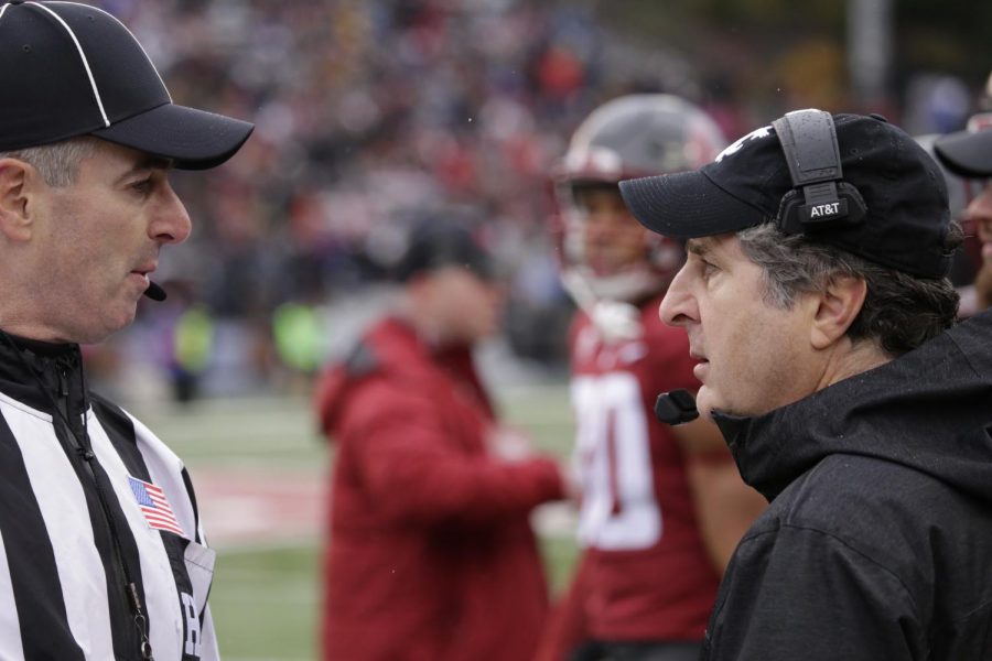 WSU+Head+Coach+Mike+Leach+has+a+conversation+with+a+referee+during+a+break+in+the+game.+Leach+saw+several+of+the+coaches+he+hired+when+he+first+arrived+in+Pullman+leave+this+offseason.+