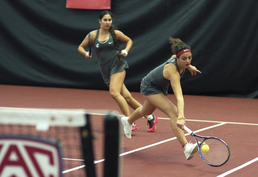Junior Tiffany Mylonas, right, and sophomore Guzal Yusupova, left, play the first doubles match against EWU on Saturday at the Hollingbery Fieldhouse.
