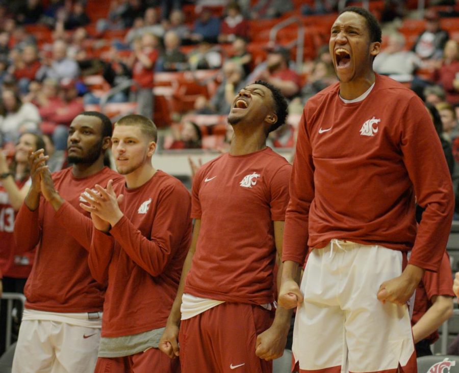 From left, redshirt freshman guard Milan Acquuah, freshman guard TJ Mickelson, redshirt freshman guard Jamar Ergas and junior forward Davante Cooper celebrate from the bench during the game against Utah on Feb. 17 at Beasley Coliseum.
