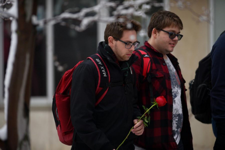 Ryan Wheeler, a member of the Phi Mu Alpha Sinfonia, on his way to deliver a rose. Students across campus employ the sinfonia to serenade a lucky recipient on Valentine’s Day.