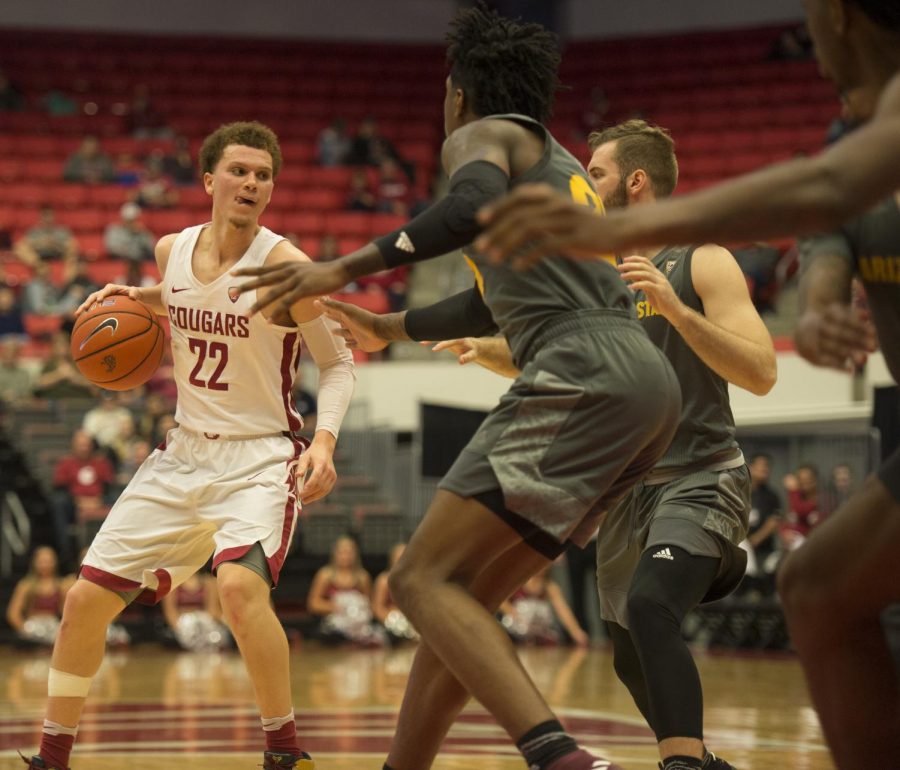 WSU sophomore guard Malachi Flynn looks for a pass during Sunday’s game against ASU in Beasley Coliseum.