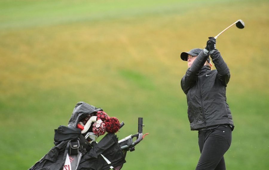 Junior Madison Odiorne hits the ball down the fairway as she competes in a tournament earlier this season.