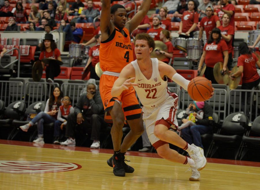 Sophomore guard Malachi Flynn moves past Oregon State freshman forward Alfred Hollins as he advances towards the net during the game against Oregon State on March 3 at Beasley Coliseum.