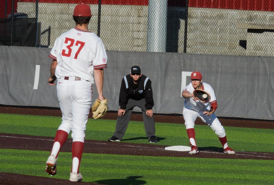 After Santa Clara scores 5 runs in an inning due to numerous mistakes by Washington State, senior first baseman James Rudkin chases down the Bronco runner Friday evening at Bailey-Brayton Field.