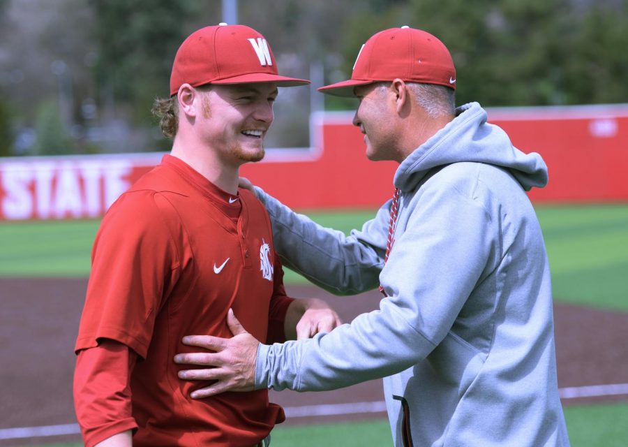 Senior left-handed pitcher Scotty Sunitsch, left, talks with Head Coach Marty Lees after practice Tuesday at Bailey–Brayton Field.