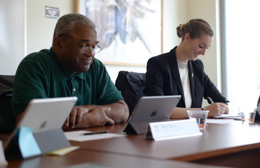 Ron Sims, left, vice chair of the WSU Board of Regents, and Alyssa Norris, student regent, listen during a Board of Regents meeting last September. The Board of Regents unanimously approved a new athletics budget plan aimed at reducing the departments multi-million dollar deficit Friday.