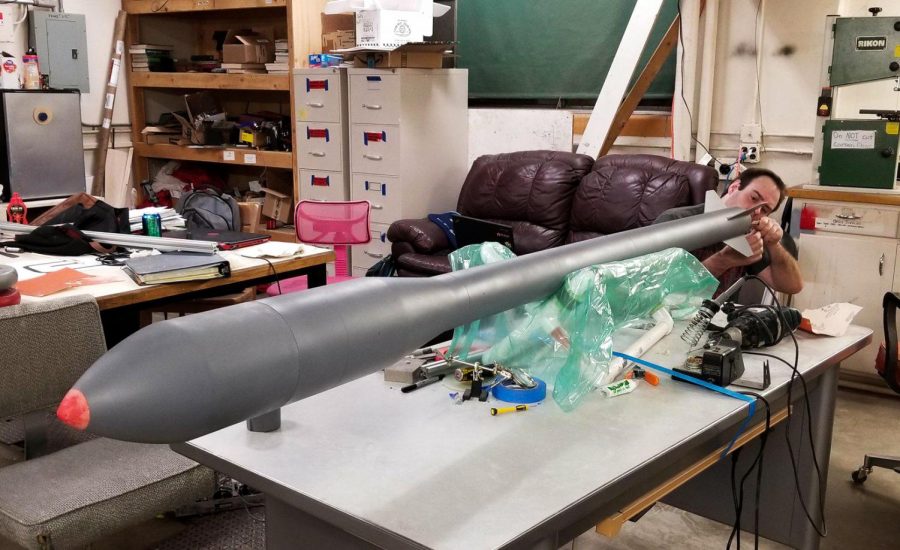Sean Journot, a senior mechanical engineering major, works on a rocket as part of his capstone project.