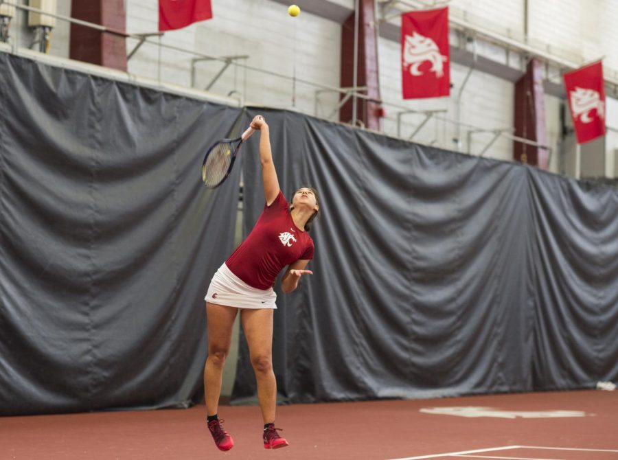 Sophomore+Guzal+Yusupova+serves+the+ball+in+her+match+against+Colorado+on+April+1+at+Hollingbery+Fieldhouse.+WSU+defeated+the+Buffaloes+4-0.