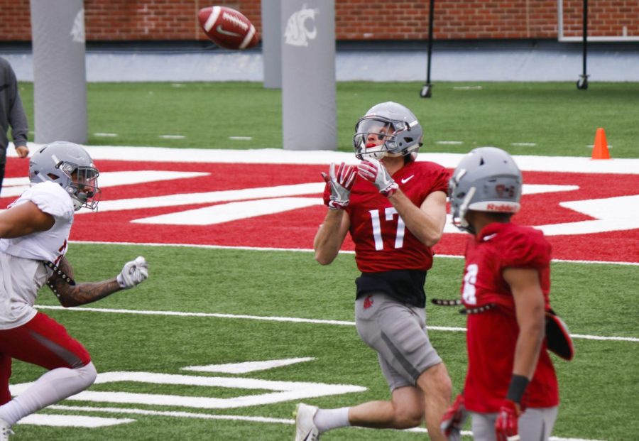 Senior wide receiver Kyle Sweet prepares to catch a pass during a spring practice at Martin Stadium.  