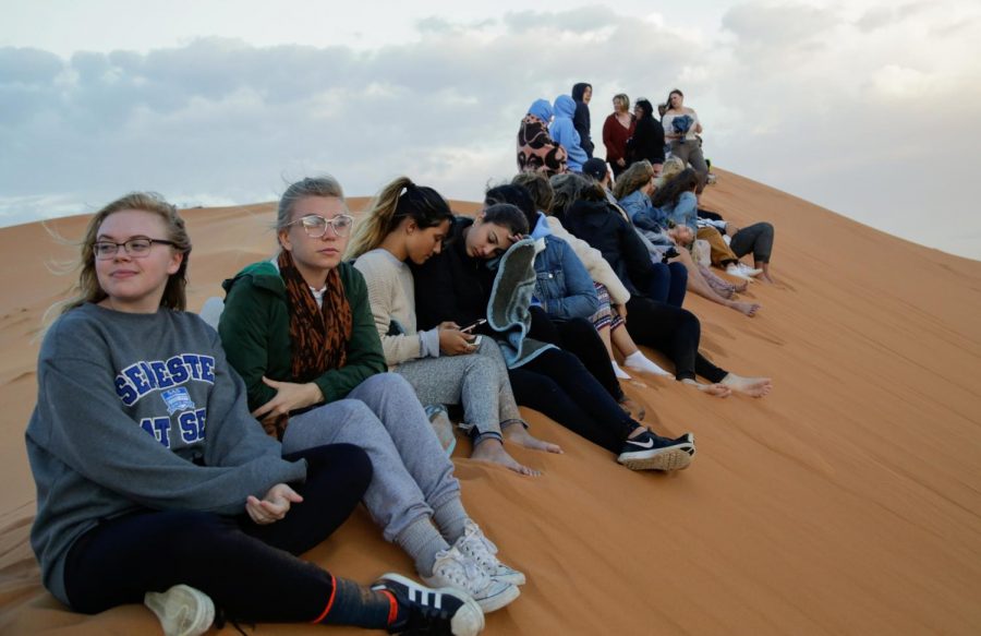 Courtesy of Ryan Pugh
In the portion of the Moroccan Sahara Desert, Semester at Sea students rest after riding on the back of a camel. 