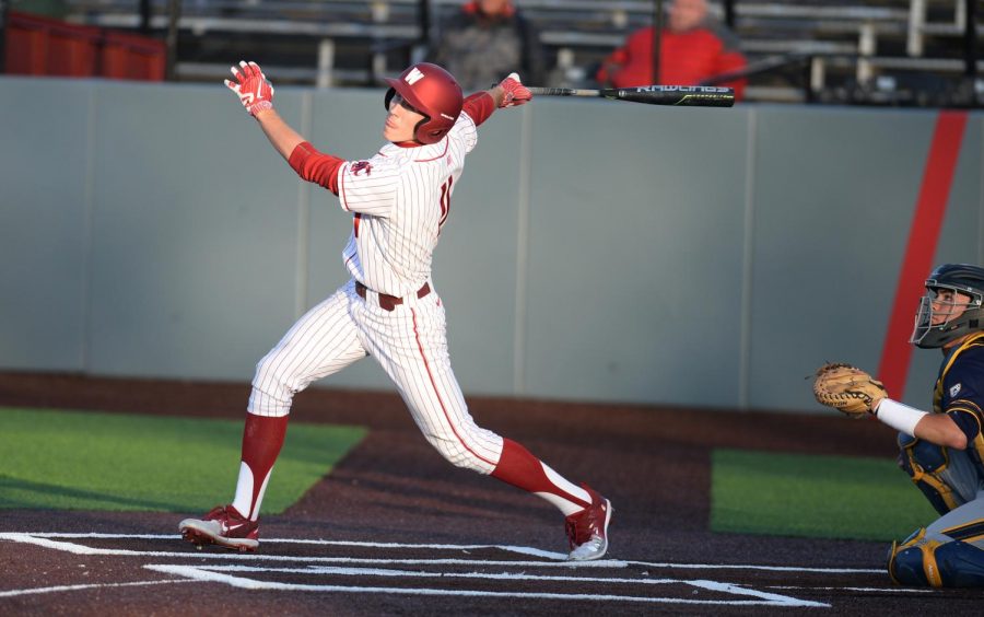 Then-sophomore+infielder+Dillon+Plew+watches+the+ball+as+he+holds+his+follow-through+during+game+three+of+the+series+against+California+on+April+14%2C+2018+at+Bailey-Brayton+Field.