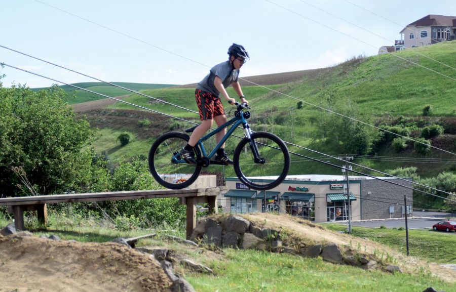 Samson “Spidey” Wolsburn, a member of the Three Forks Bike Club, takes flight on his bike off of a jump at the club’s track near Lincoln Middle School on Crestview Street on May 23.