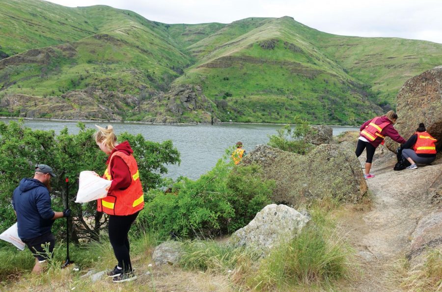 Students and faculty from WSU and the University of Idaho pick up items such as glass and plastic at Granite Point, also known as the cliffs, on May 10. The park reopened the day after the cleanup.